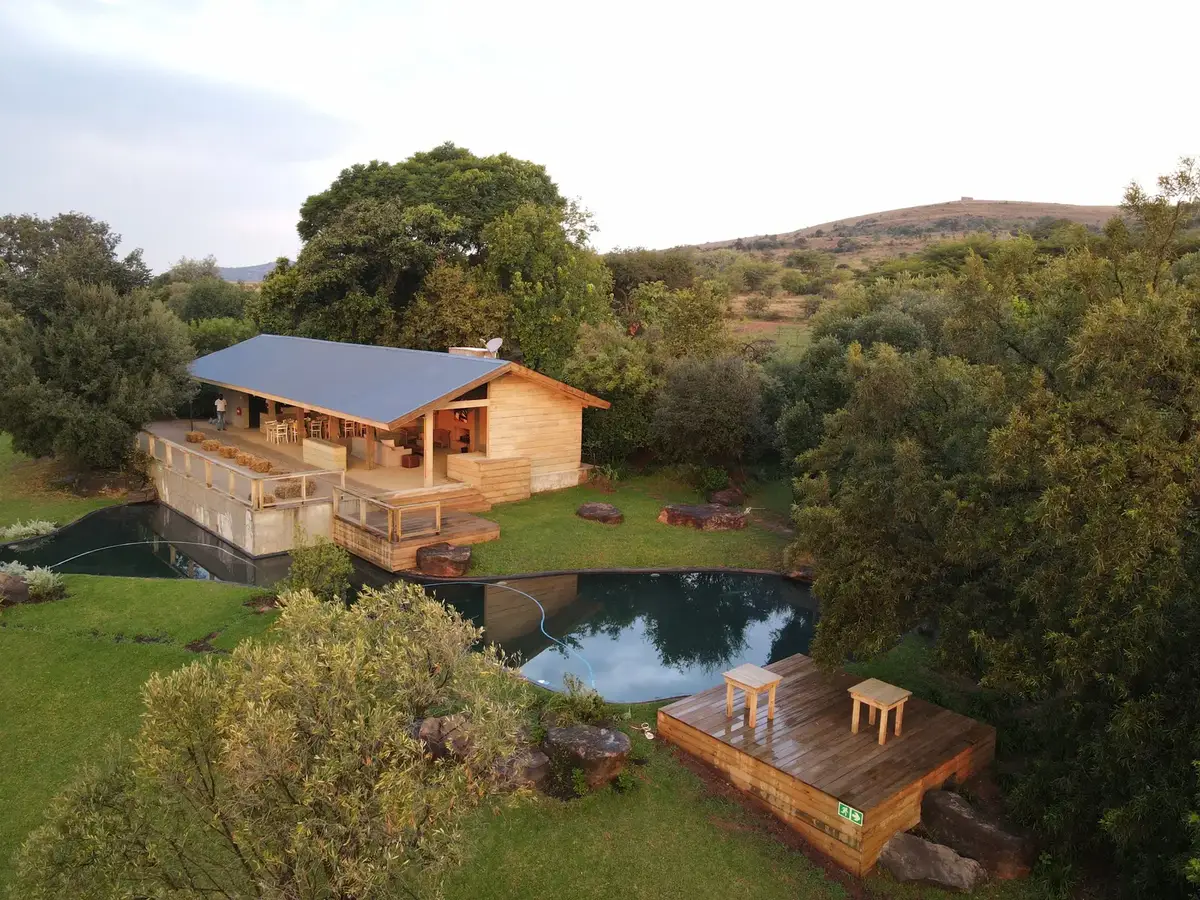 Timber building, pool and trees at 58 in the Cradle